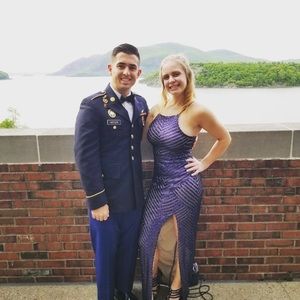 Floor length blue sequined gown, left sided slit